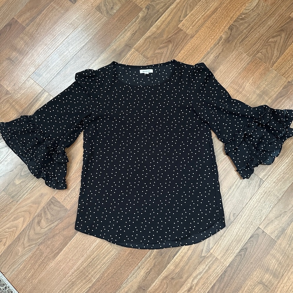 Black and white polka dot blouse with ruffled cuff